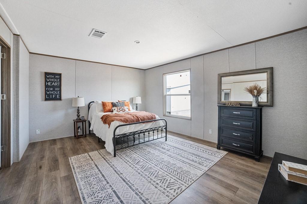 164 Ranya Loop Decatur, TX 76234 - Photo 17 of 31 a bed room with a bed and a window