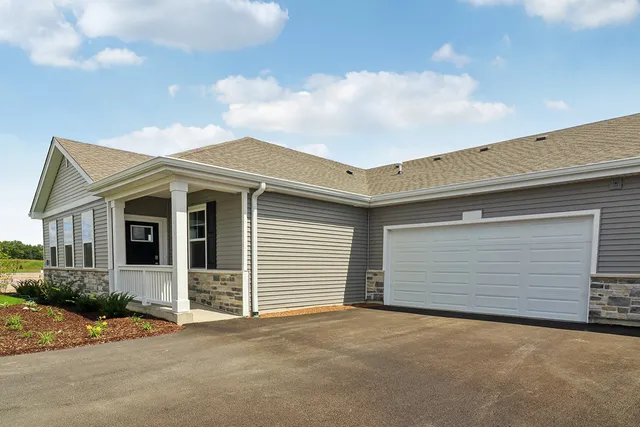 a front view of a house with a garage
