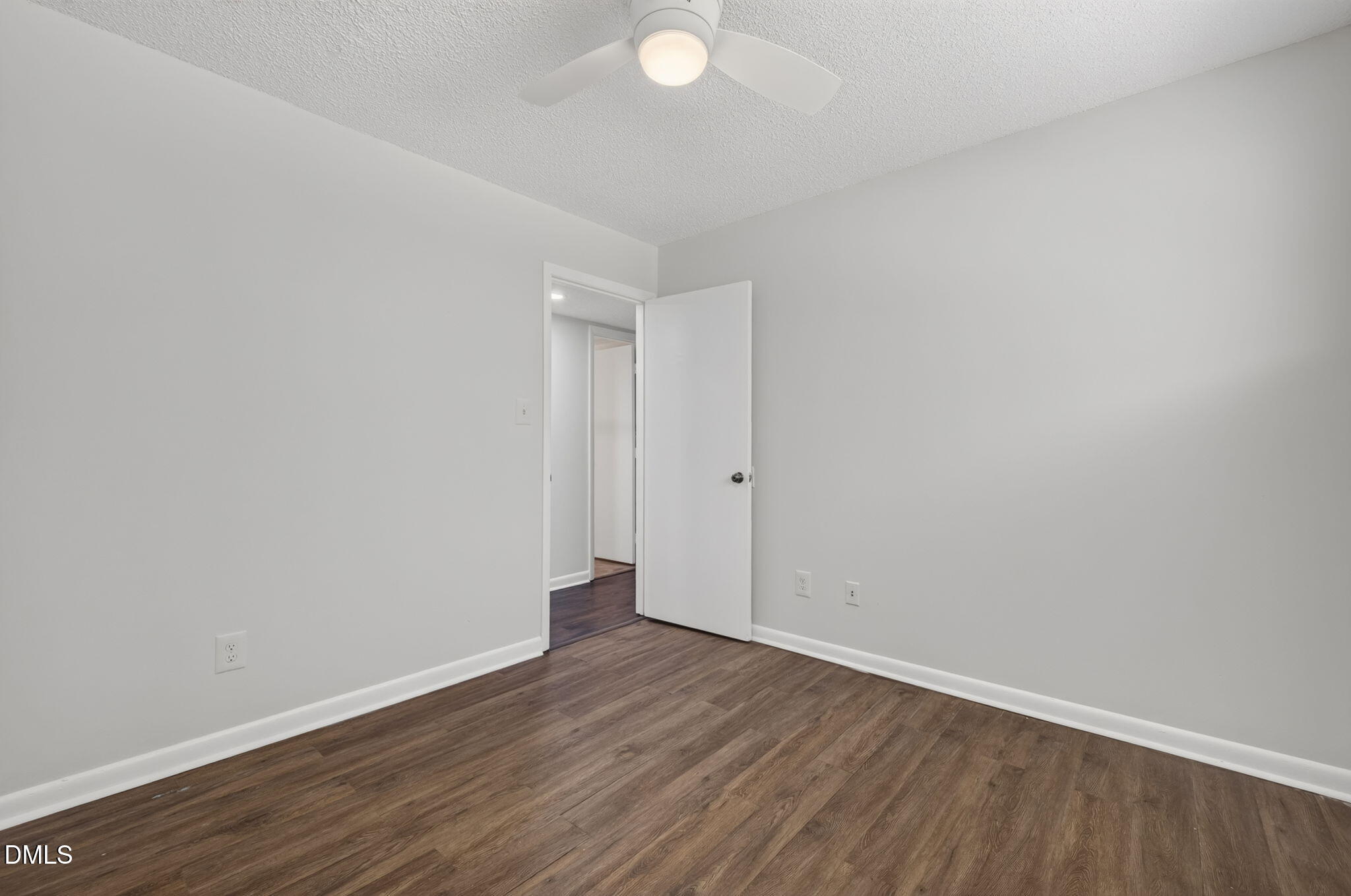 546 Pine Ridge Place Raleigh, NC 27609 - Photo 16 of 21 a view of an empty room with wooden floor