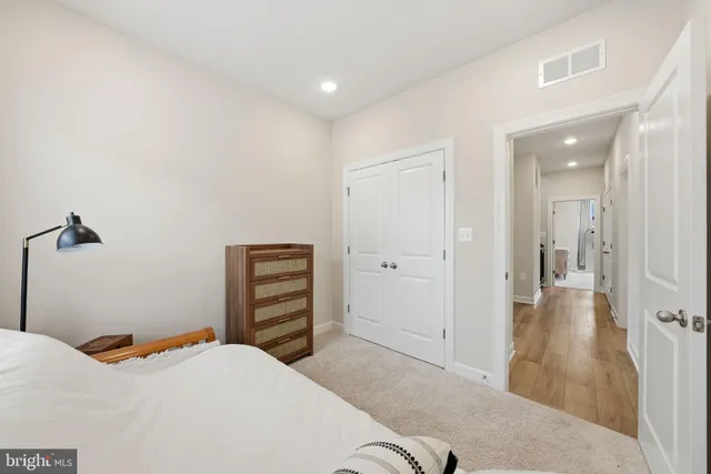 a bedroom with a bed and a bathroom