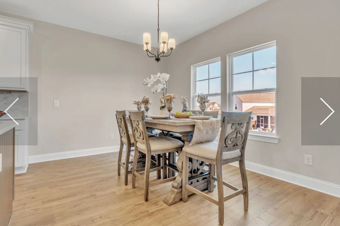 6509 Ripple Ridge Columbia, TN 38401 - Photo 17 of 20 a view of a dining room with furniture a chandelier and wooden floor