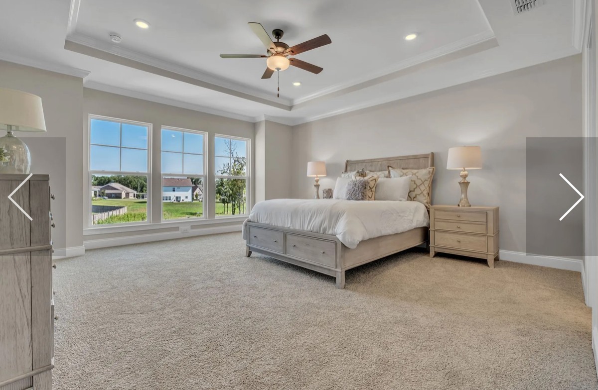 6509 Ripple Ridge Columbia, TN 38401 - Photo 18 of 20 a spacious bedroom with a bed and a ceiling fan