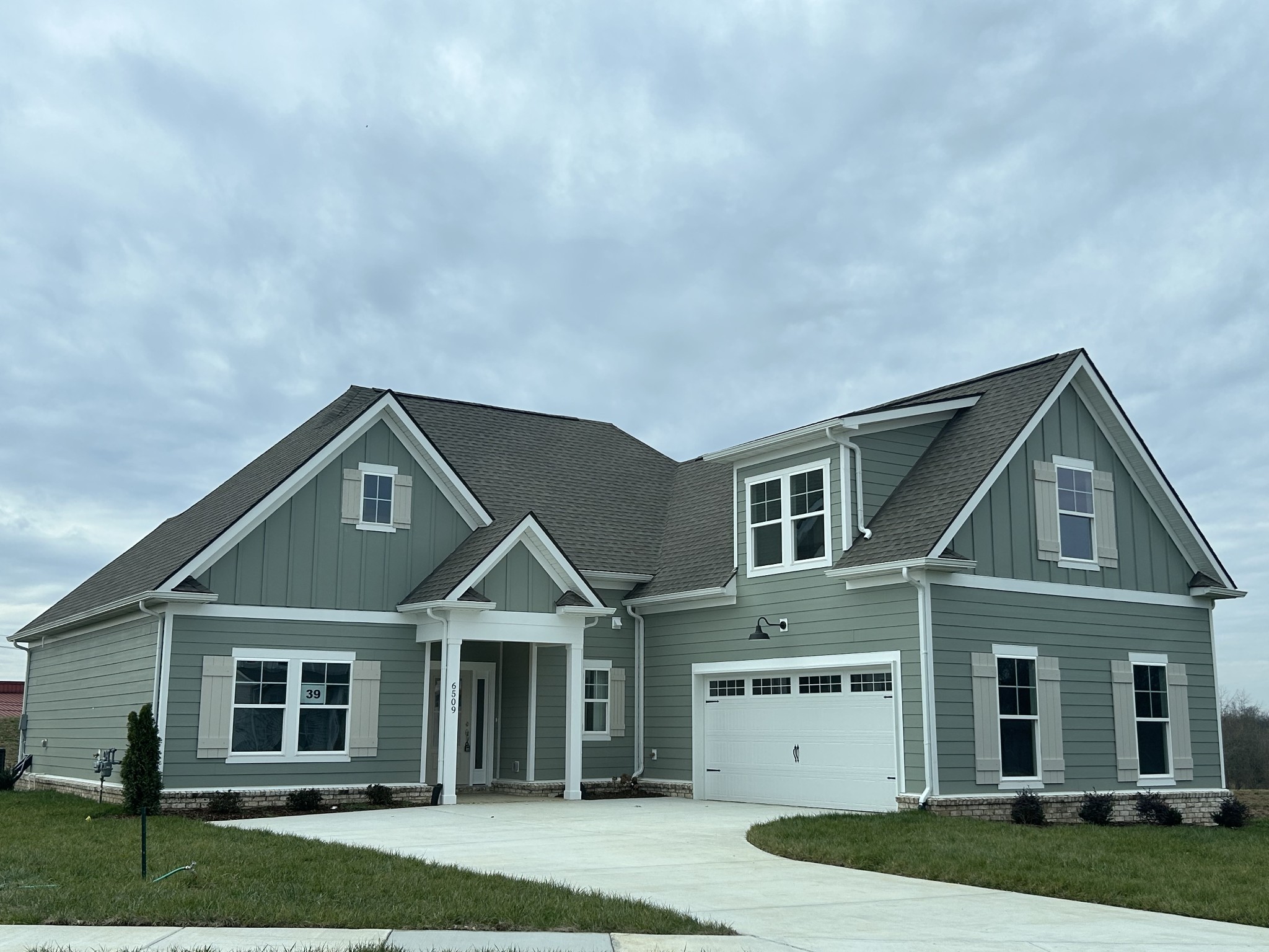 6509 Ripple Ridge Columbia, TN 38401 - Photo 2 of 20 a front view of a house with a yard and garage