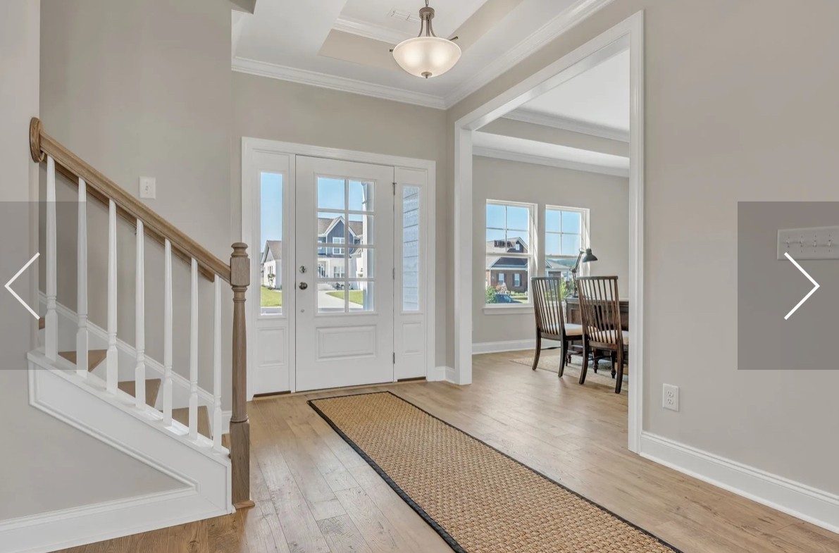 6509 Ripple Ridge Columbia, TN 38401 - Photo 6 of 20 a view of a hallway with wooden floor and dining room