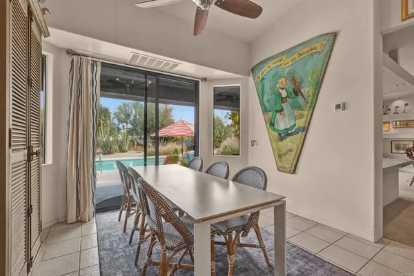 a view of a dining room with furniture window and outside view