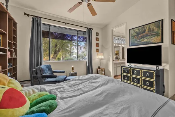 a en suite bathroom with a double vanity sink and a mirror