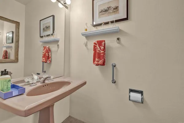 a bathroom with a sink and a washing machine