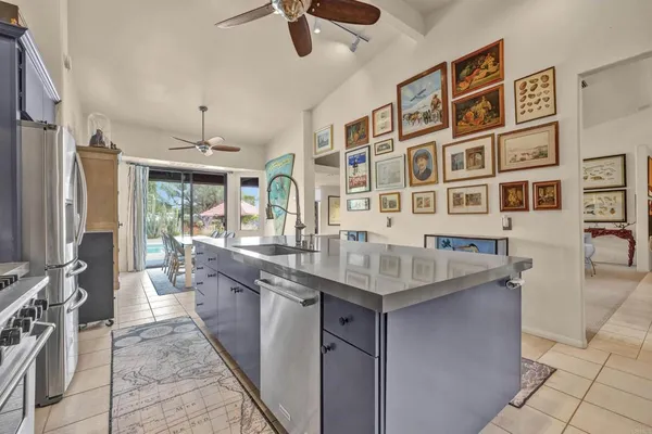 a kitchen with stainless steel appliances granite countertop a sink and cabinets