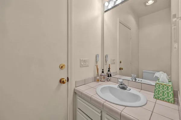 a backyard view with a seating space