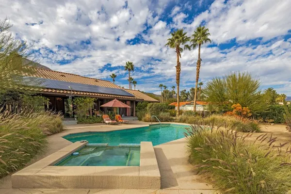 a view of a swimming pool with a patio