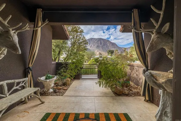 a street view with flower plants and wooden fence