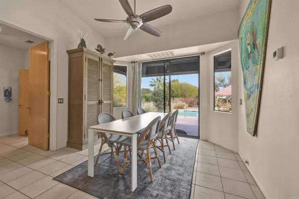 a view of a dining room with furniture window and outside view