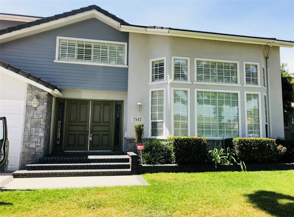 7652 Coolgrove Drive Downey, CA 90240 - Photo 1 of 2 a front view of a house with a yard