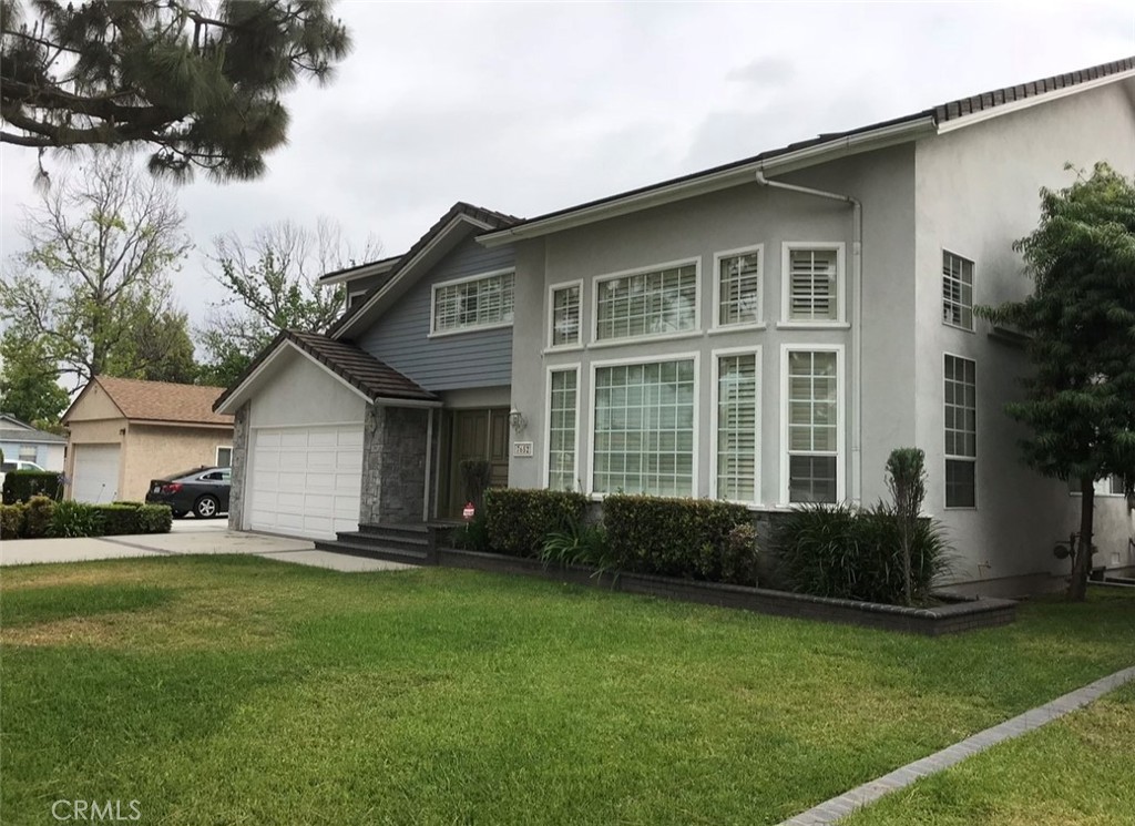 7652 Coolgrove Drive Downey, CA 90240 - Photo 2 of 2 a front view of a house with a yard