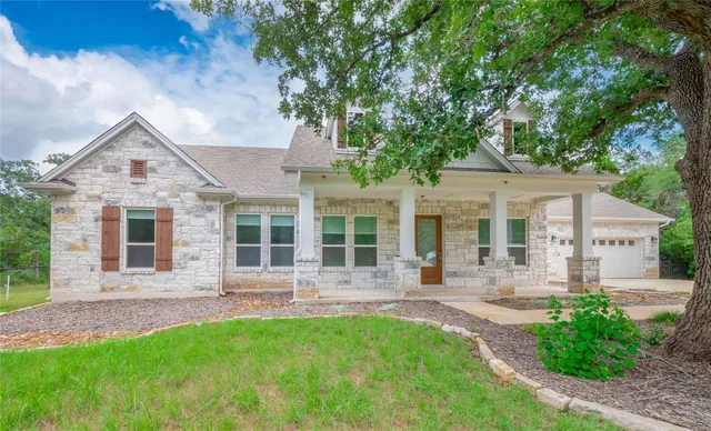 front view of a house with a yard