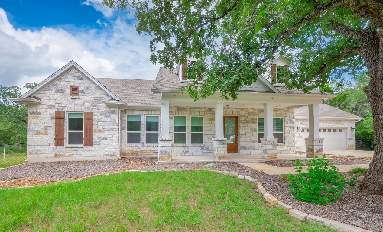 front view of a house with a yard