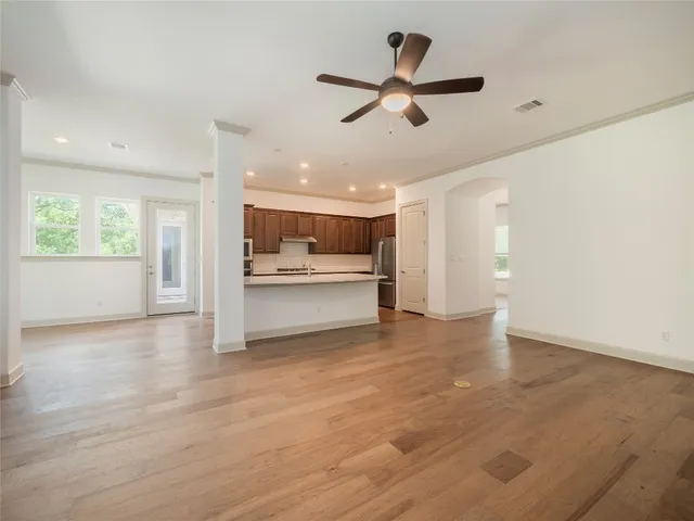 a view of kitchen with refrigerator and window