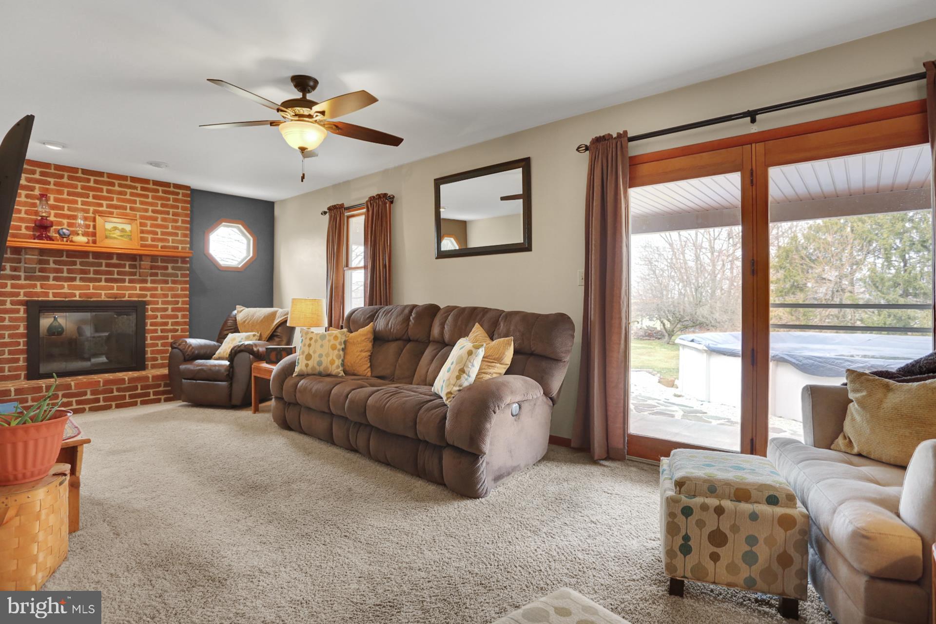 253 South View Road Fleetwood, PA 19522 - Photo 16 of 35 Family room with brick wood burning fireplace.