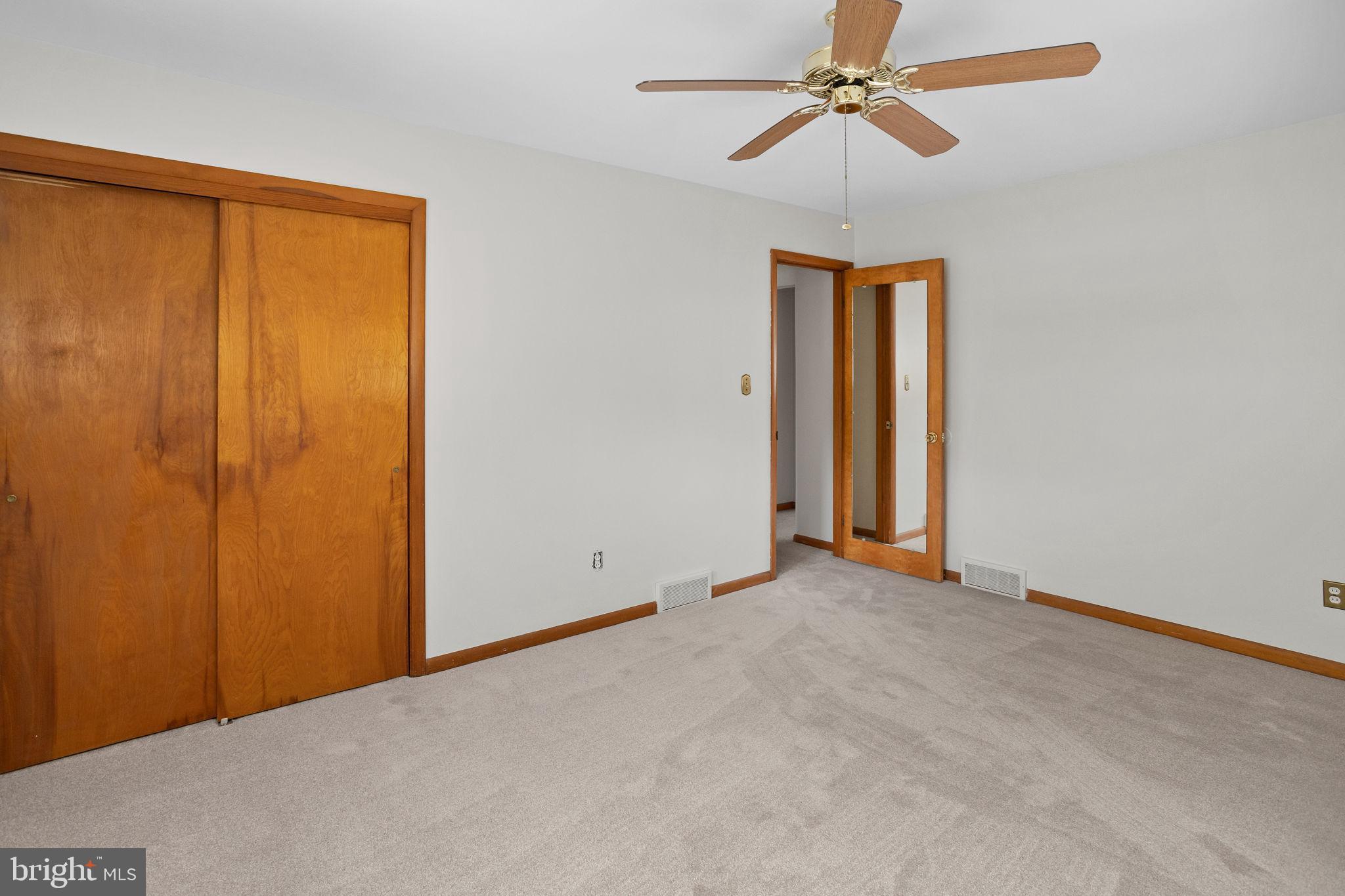 96 Bordentown Chesterfield Road Chesterfield, NJ 08515 - Photo 17 of 42 an empty room with windows and fan