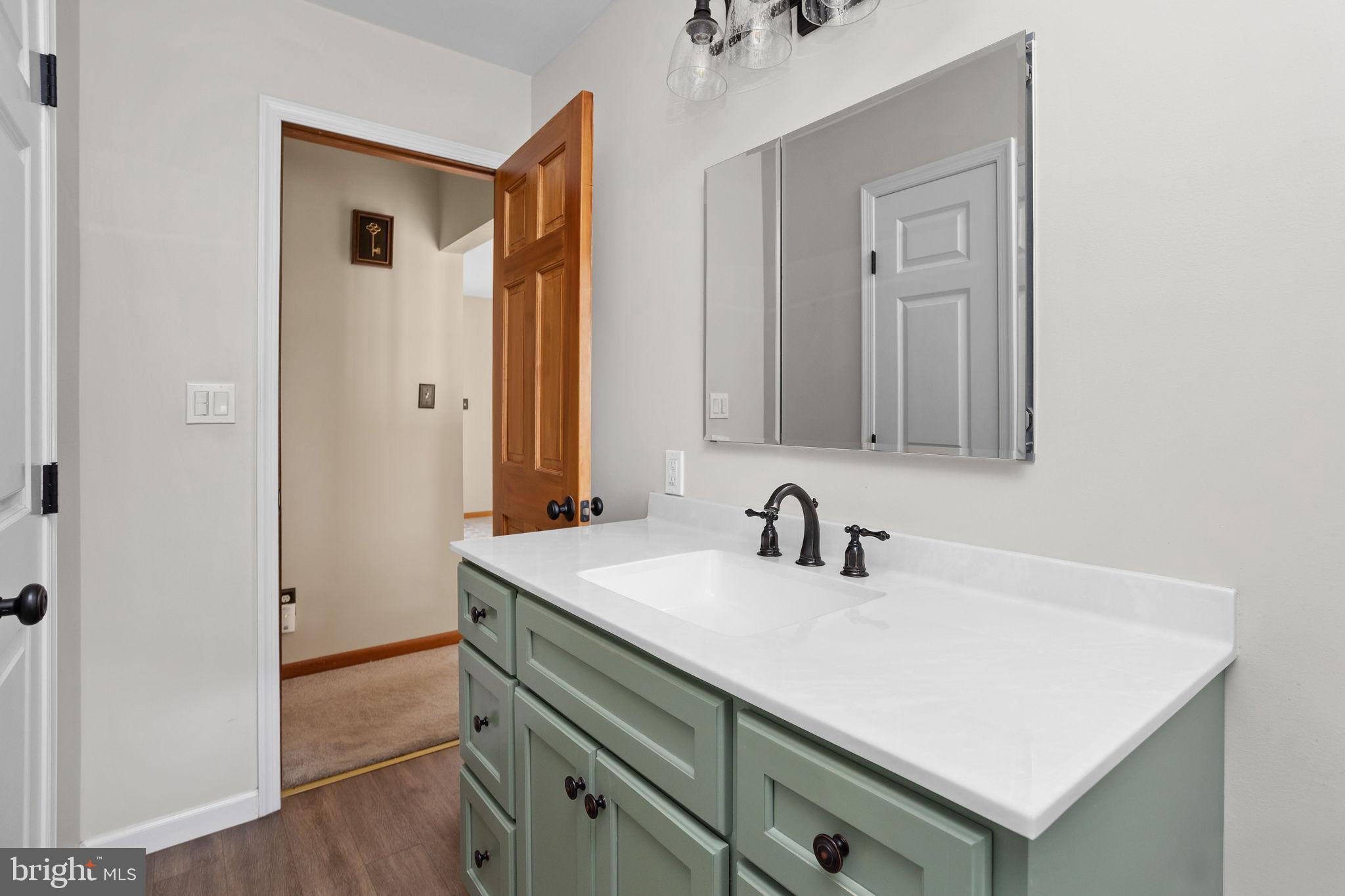 96 Bordentown Chesterfield Road Chesterfield, NJ 08515 - Photo 20 of 42 a bathroom with a sink and a mirror