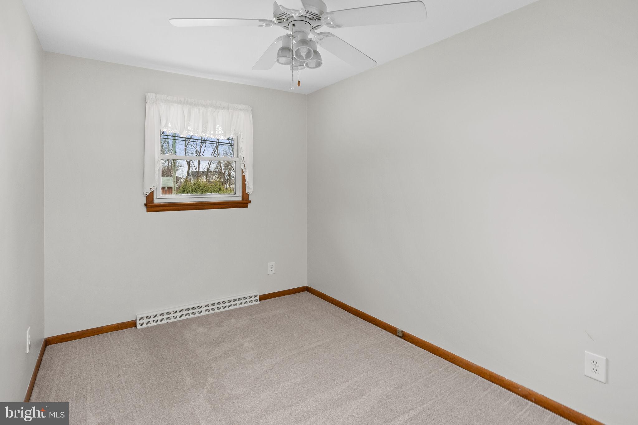 96 Bordentown Chesterfield Road Chesterfield, NJ 08515 - Photo 21 of 42 an empty room with a window and a fan