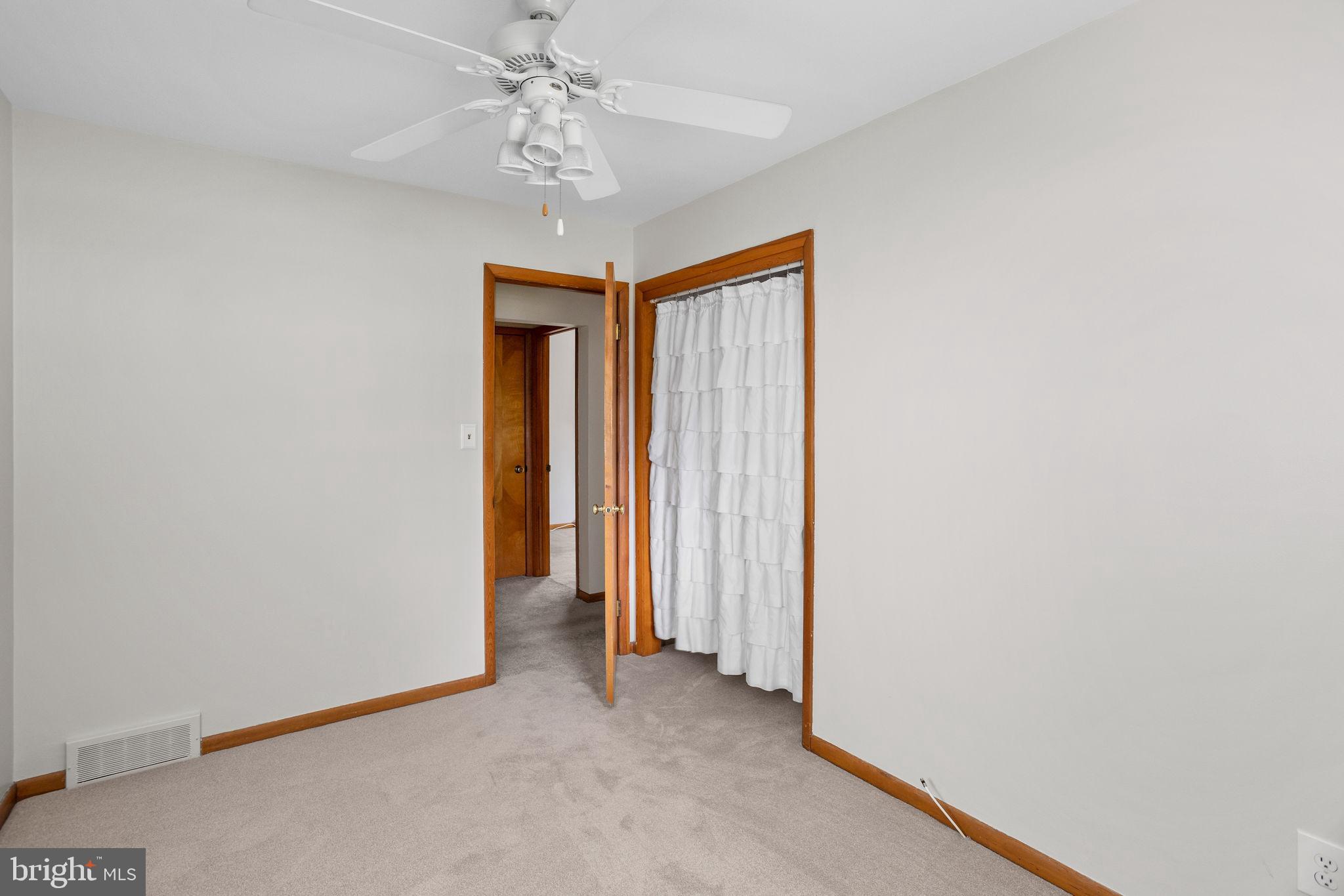 96 Bordentown Chesterfield Road Chesterfield, NJ 08515 - Photo 22 of 42 a view of a hallway with a chandelier
