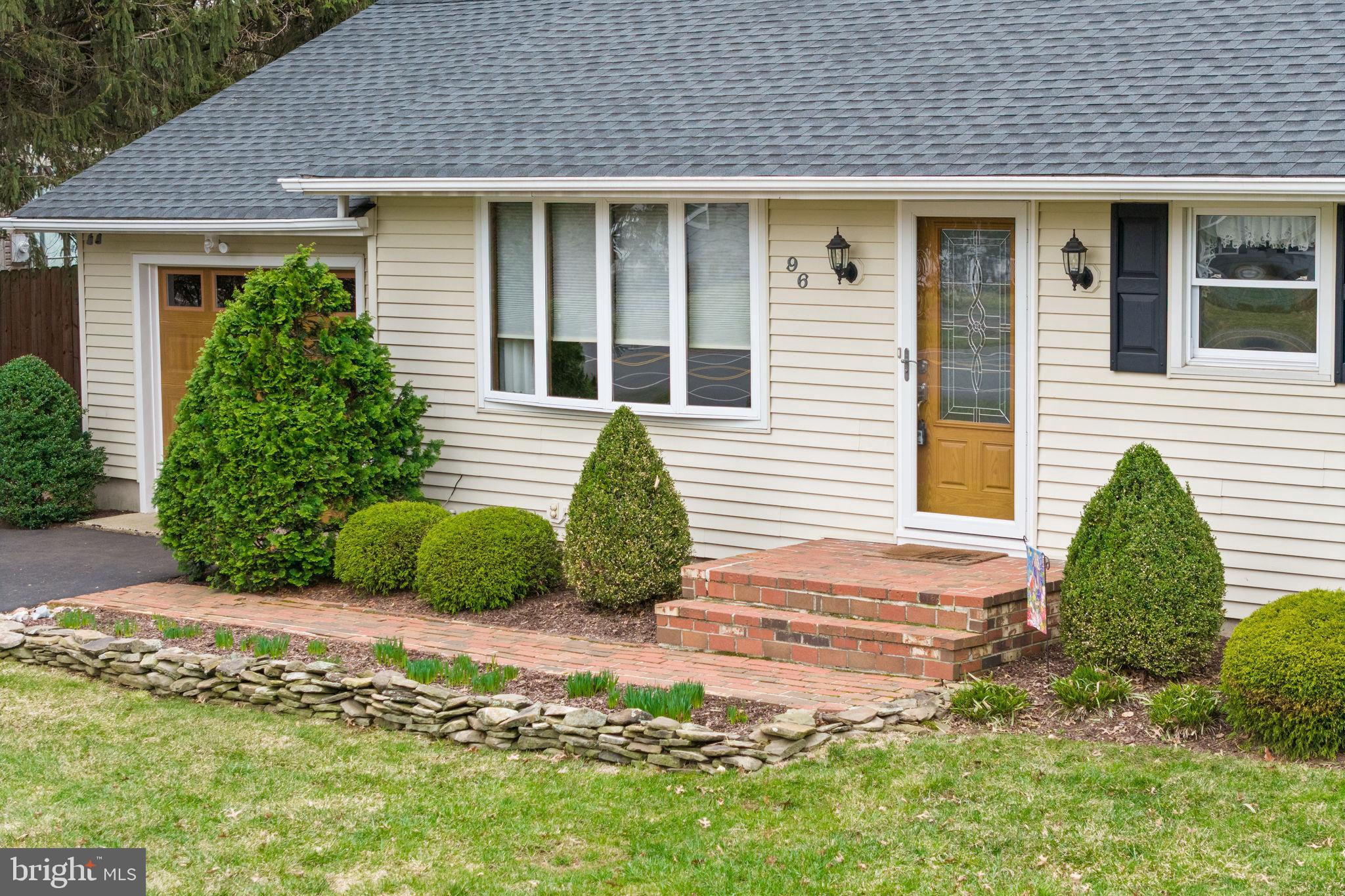 96 Bordentown Chesterfield Road Chesterfield, NJ 08515 - Photo 6 of 42 a front view of a house with a garden