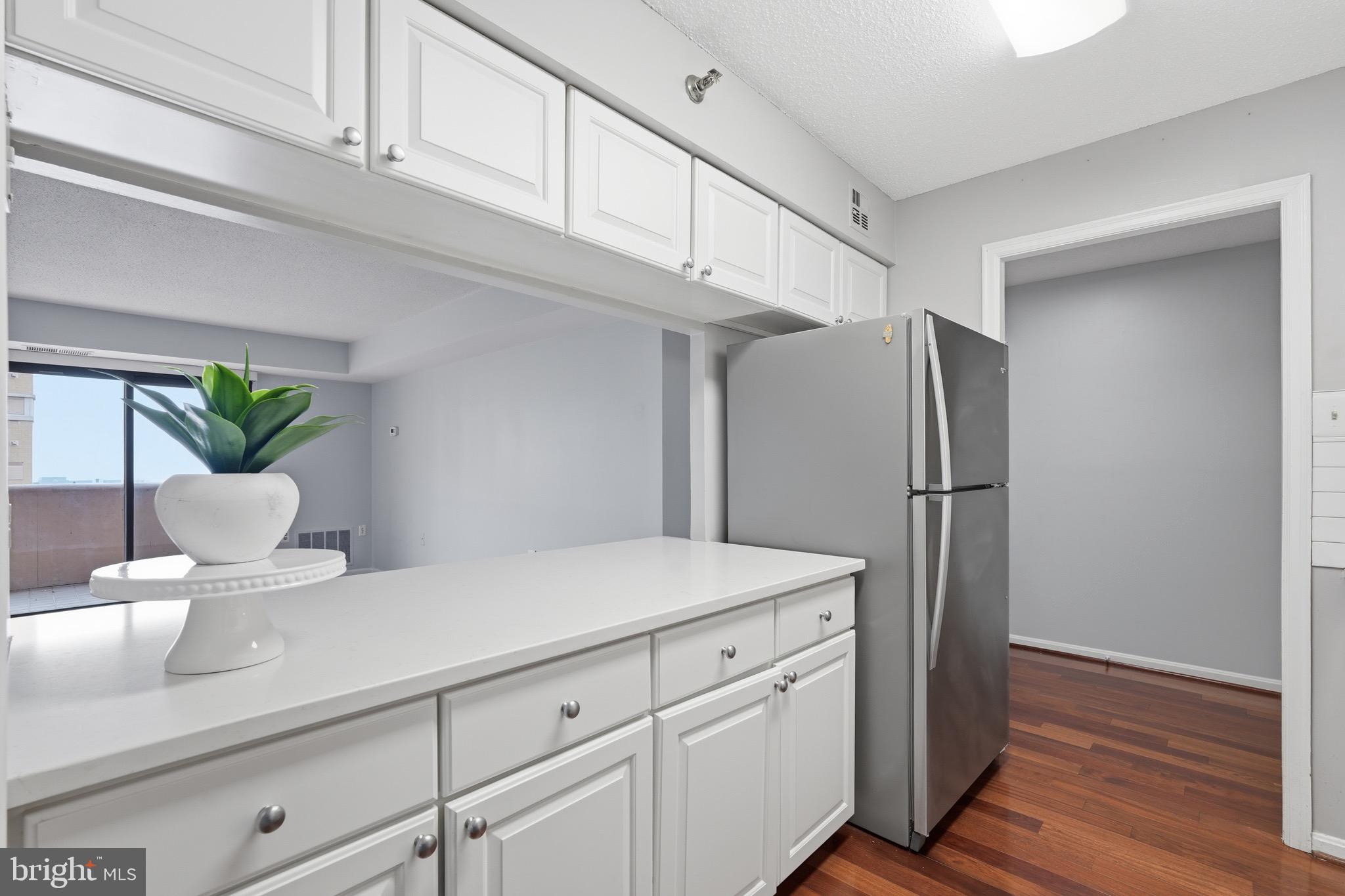 1301 North Courthouse Road, Unit 1610 Arlington, VA 22201 - Photo 7 of 30 Crisp white cabinets & quartz counters