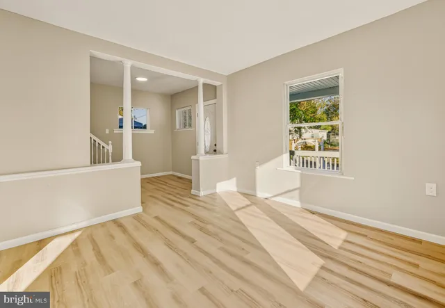 a spacious bedroom with a bed and a window