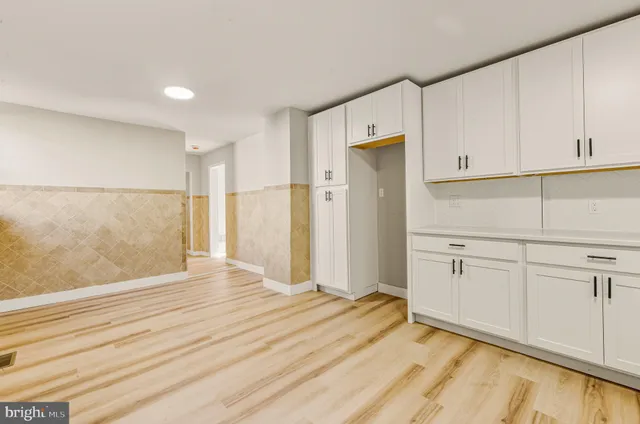 a view of a kitchen with wooden floor