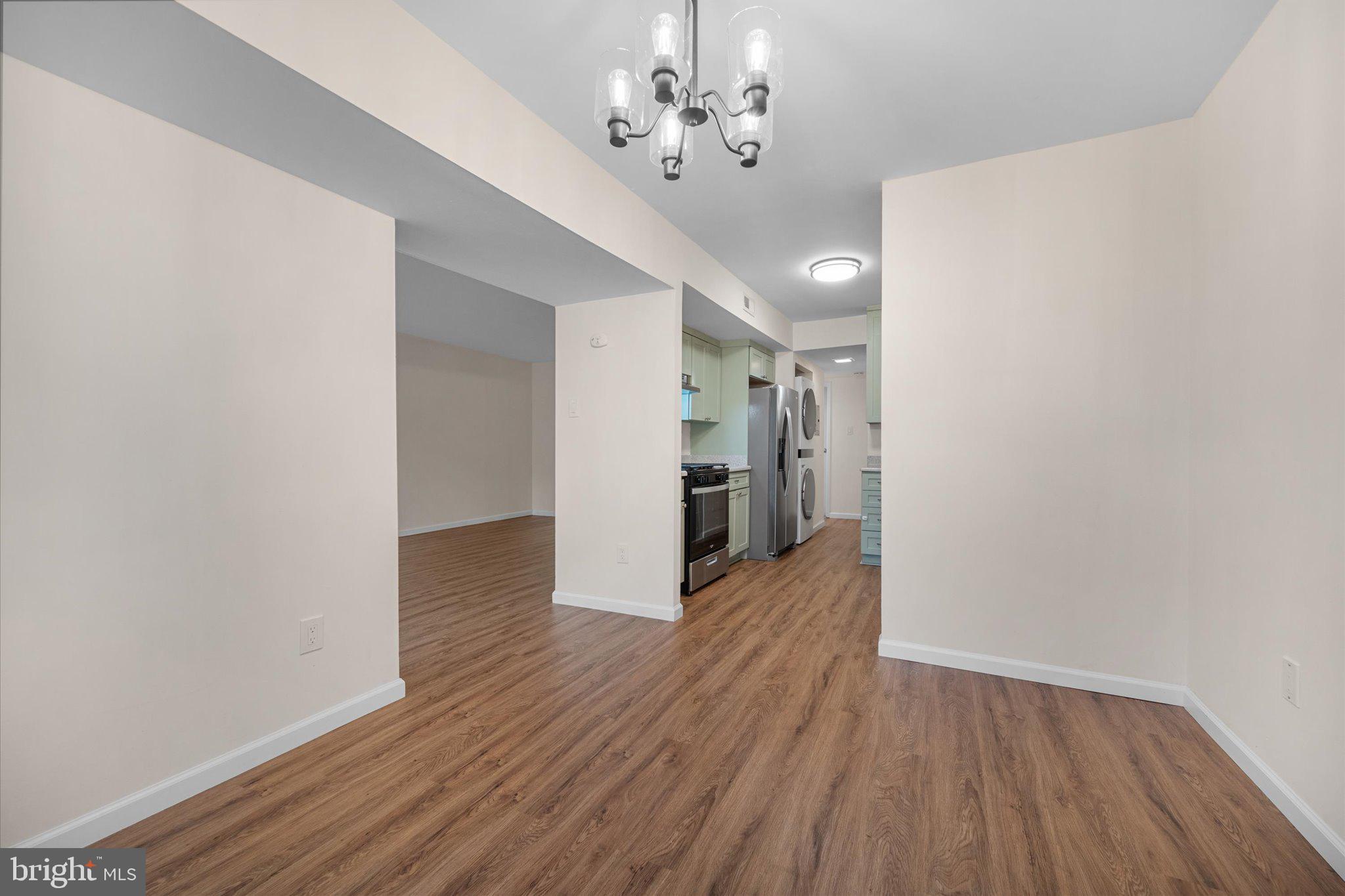 2073 Royal Fern Court, Unit 34/21B Reston, VA 20191 - Photo 14 of 25 a view of a hallway with wooden floor