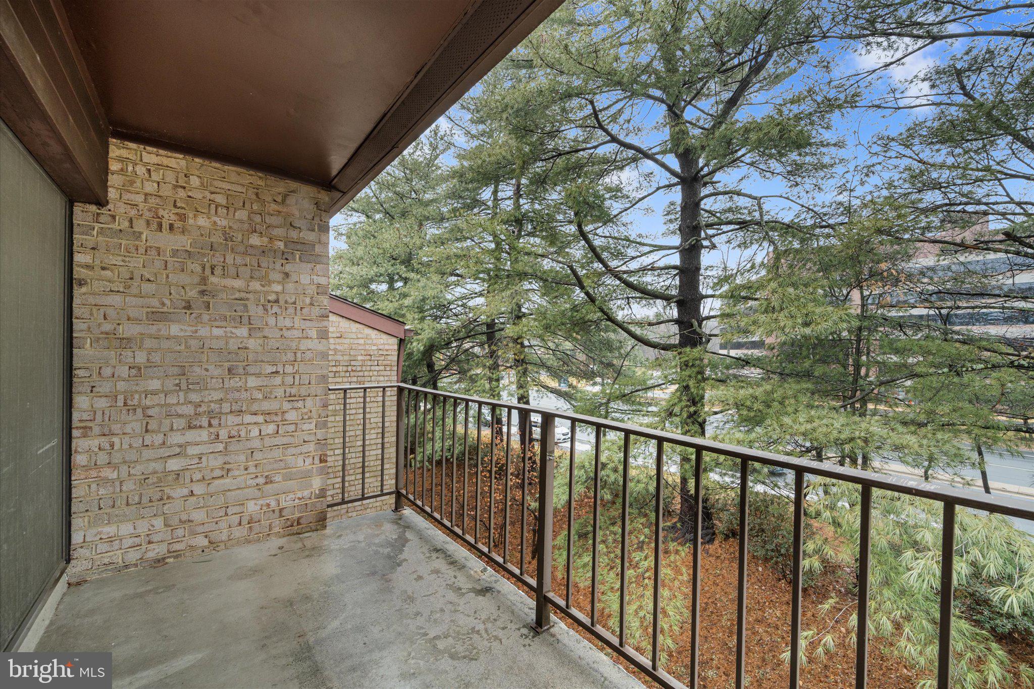 2073 Royal Fern Court, Unit 34/21B Reston, VA 20191 - Photo 23 of 25 a view of a balcony with a tree