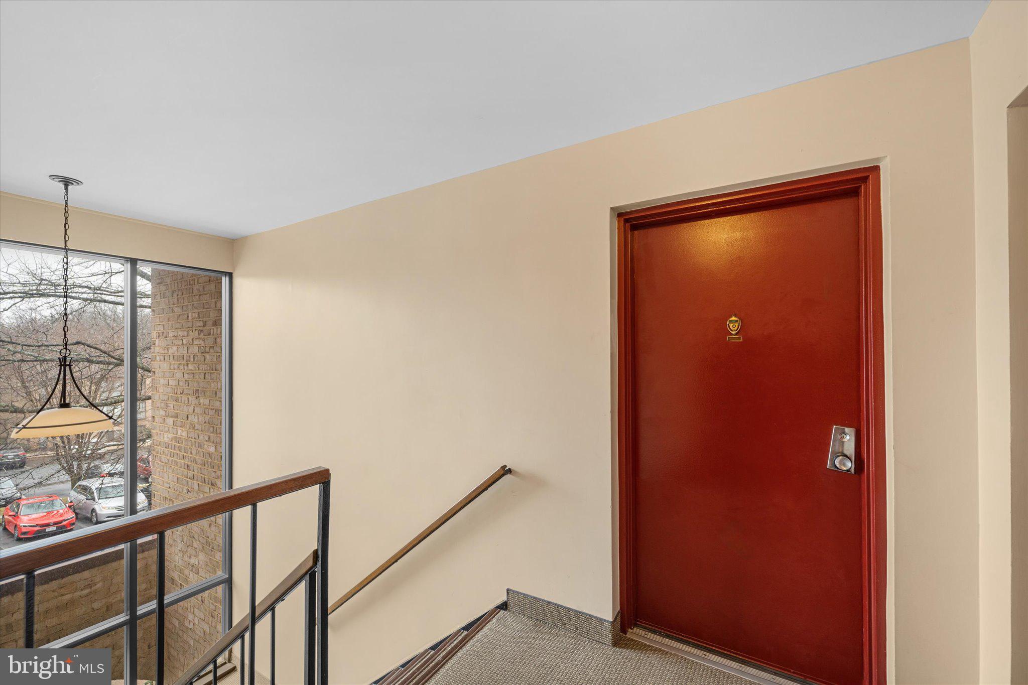 2073 Royal Fern Court, Unit 34/21B Reston, VA 20191 - Photo 4 of 25 a view of a hallway with windows