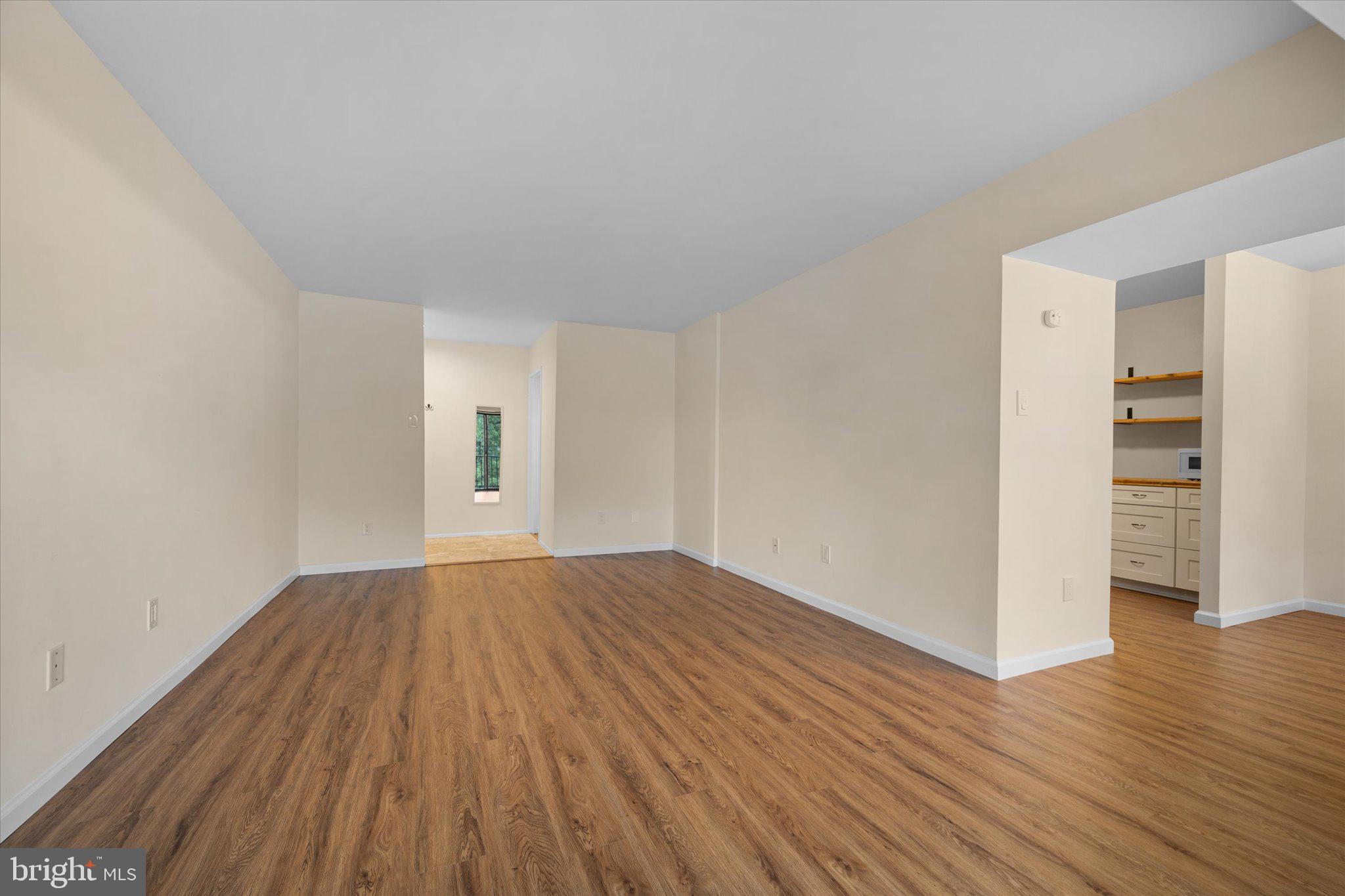 2073 Royal Fern Court, Unit 34/21B Reston, VA 20191 - Photo 7 of 25 a view of empty room with wooden floor