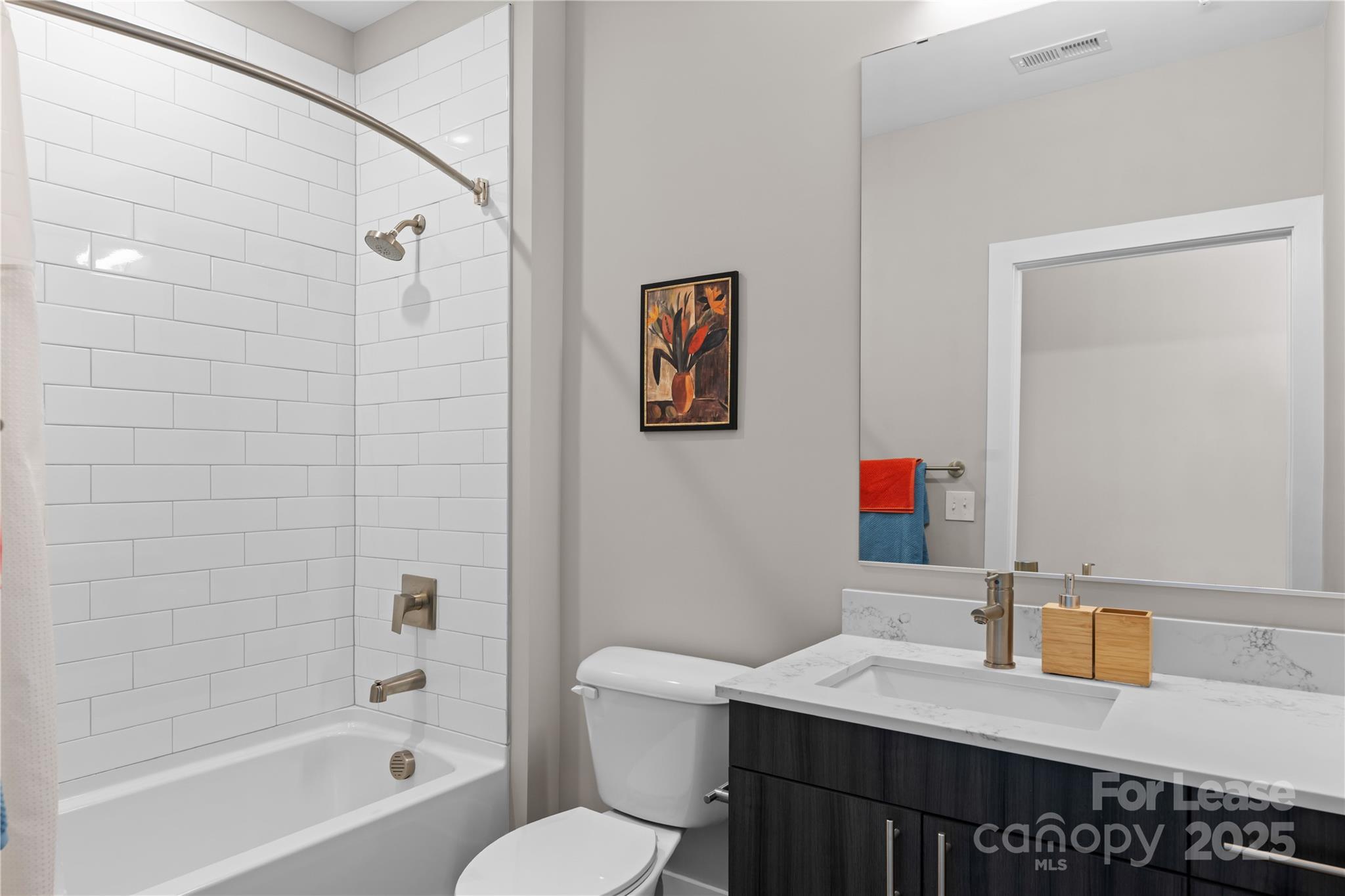 110 Razades Way, Unit A1 Charlotte, NC 28206 - Photo 29 of 29 a bathroom with a sink a toilet and shower
