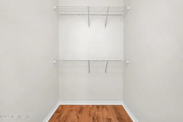 a view of a room with racks on the wall