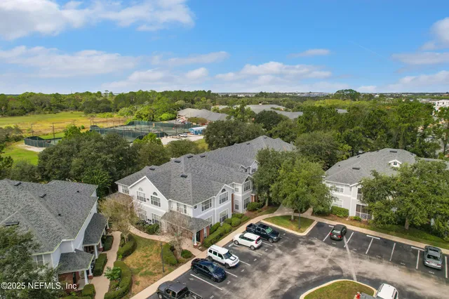 an aerial view of a house with a garden