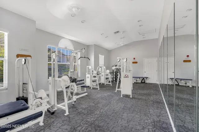a living room with lots of furniture and a rug