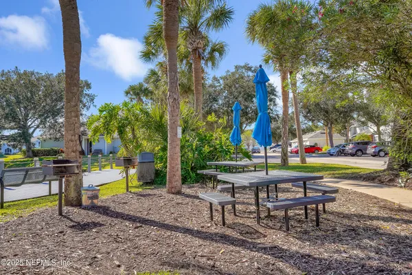 a view of park with bench and trees
