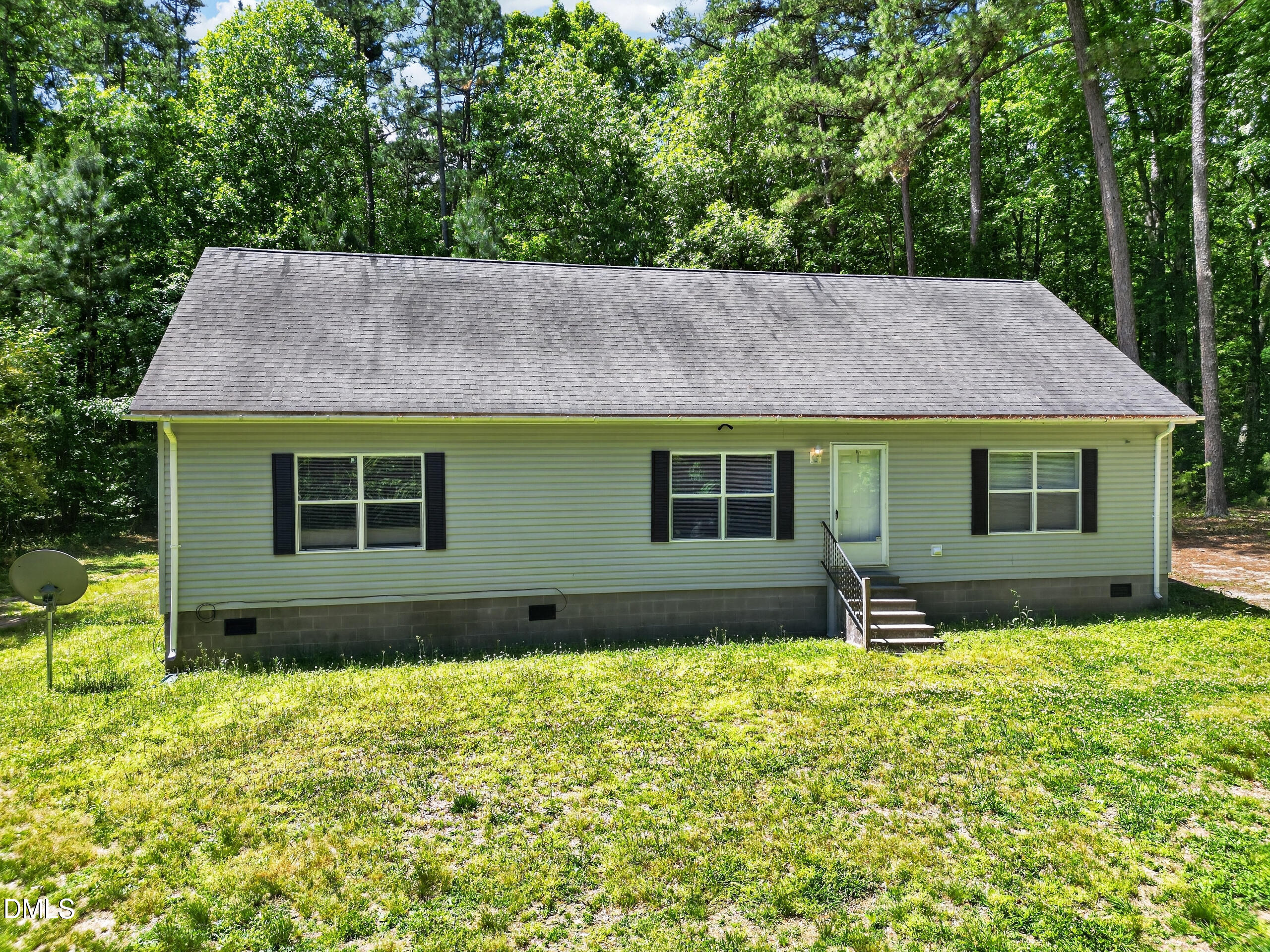 126 Hunter Road Henderson, NC 27537 - Photo 2 of 5 a front view of a house with garden