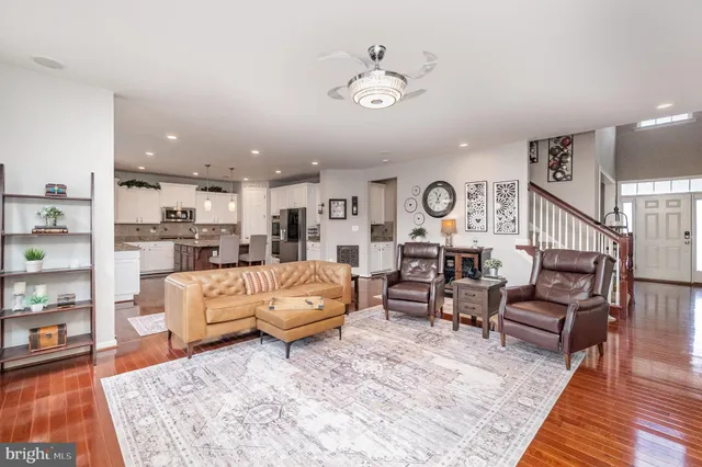 a large kitchen with a table and chairs