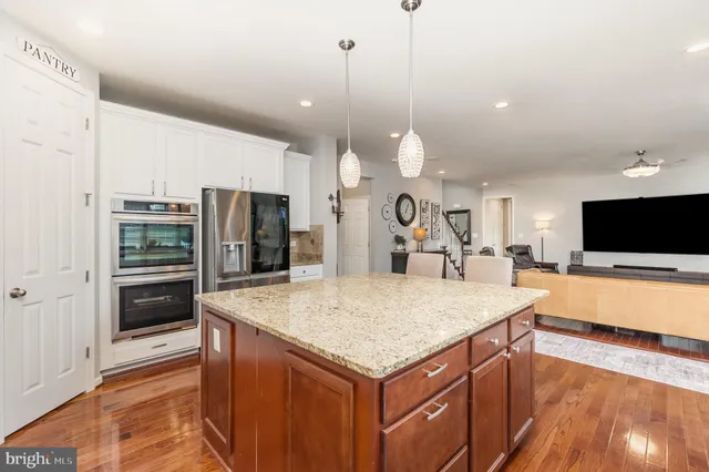 a view of a livingroom with workspace and a window