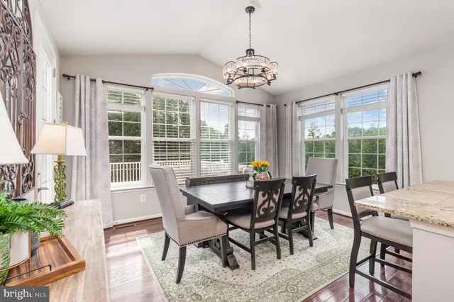 a bedroom with a bed and a mirror