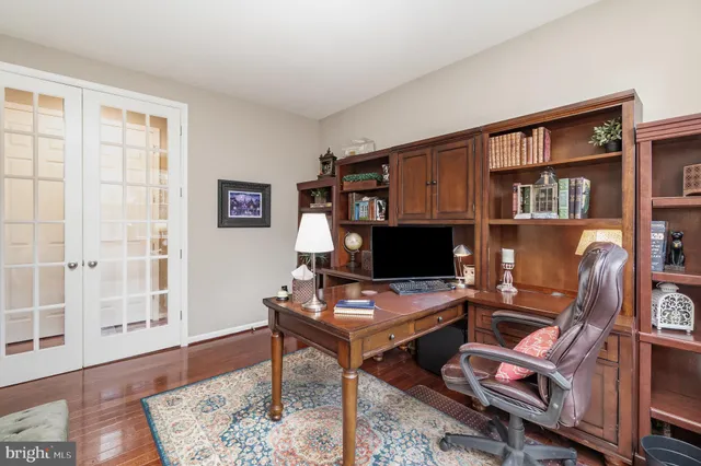 a spacious bathroom with a granite countertop tub sink shower and mirror