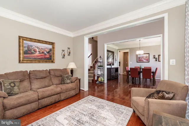 a large kitchen with a table and chairs