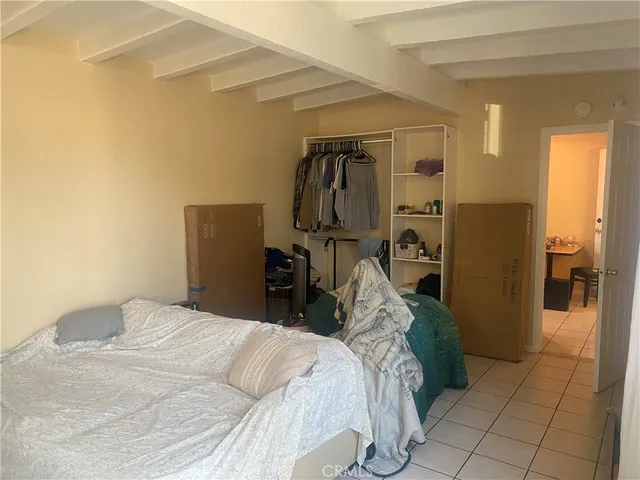a bedroom with a bed and walk in closet