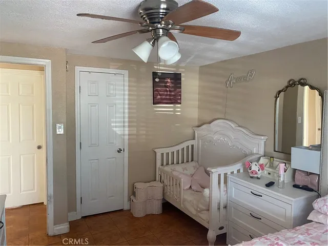 a bedroom with furniture and a chandelier