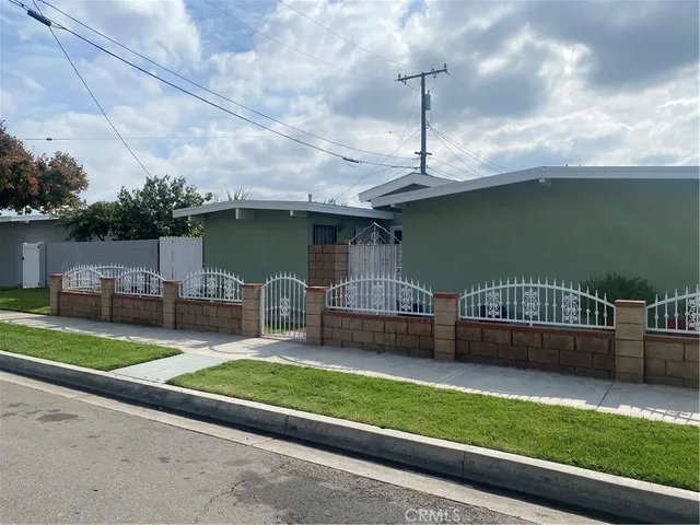 a front view of a house with a yard table and chairs