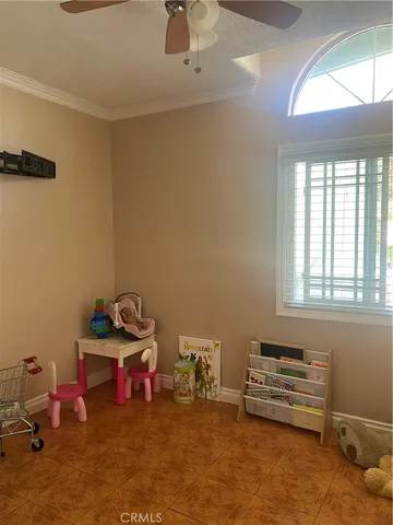 a bedroom with furniture and a window