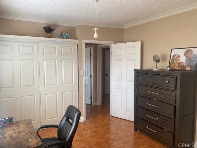 a hallway with a dresser and a couch